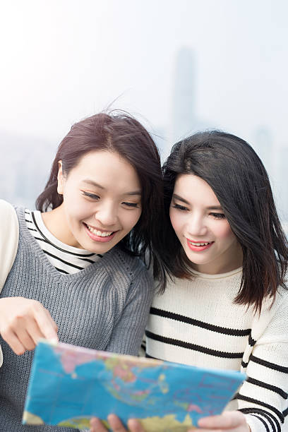 istock two beauty woman look map 621504790