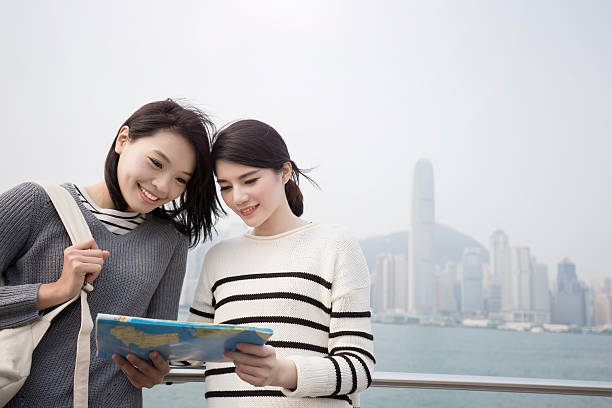 istock two beauty woman look map i 621505126