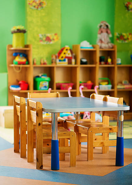 istock Chairs, table and toys. Interior of kindergarten. 621505796