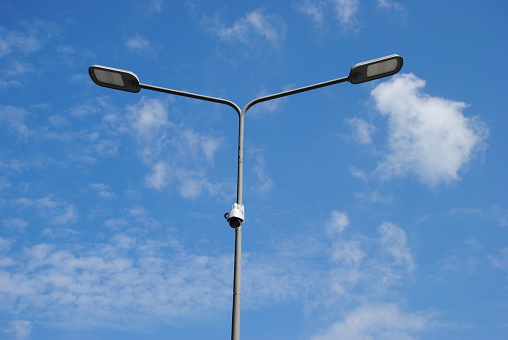 LED street lamps with energy-saving technology, cloud on blue sky daylight background 
