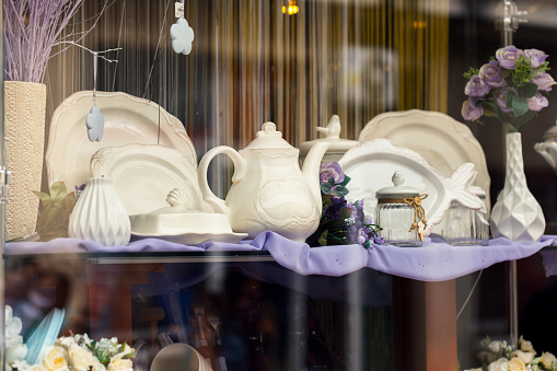Shop window with different vintage kitchen dishes.