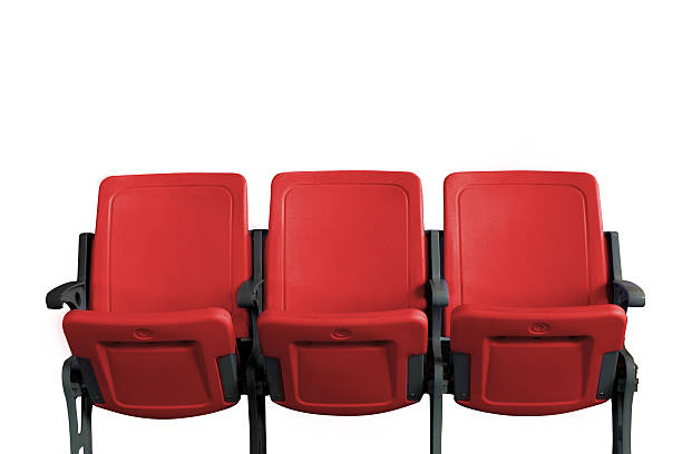 istock Empty theater auditorium or cinema with three red seats 621507210