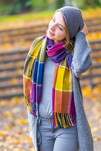 istock Woman walking at park in autumn 621507632