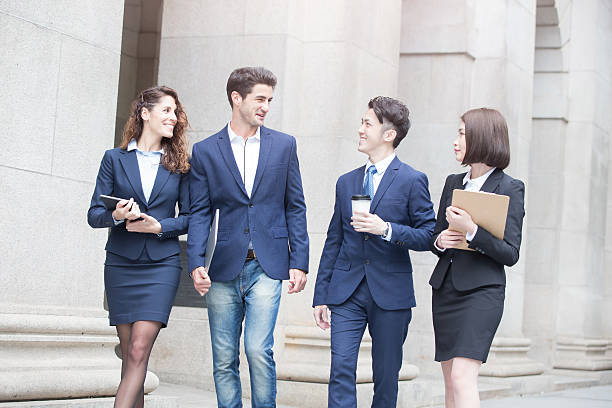 istock businesepeople walk on road 621508028