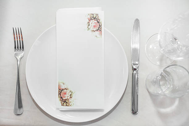 istock plate and Cutlery on the table in restaurant 621508098