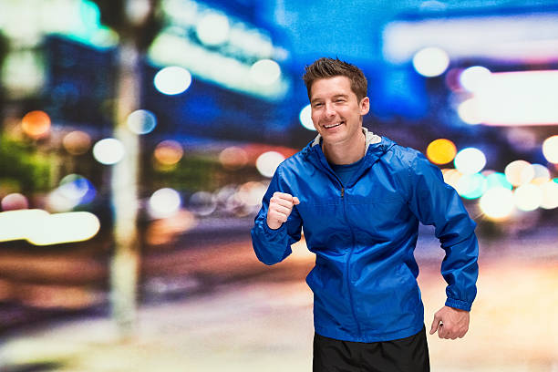 istock Smiling man running outdoors 621569174