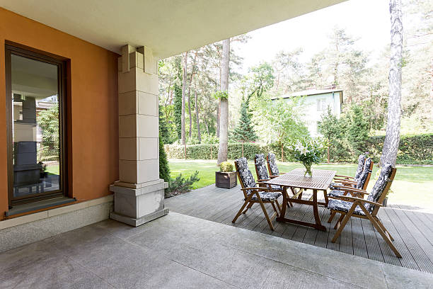 istock Veranda with wooden table and chairs 621569918