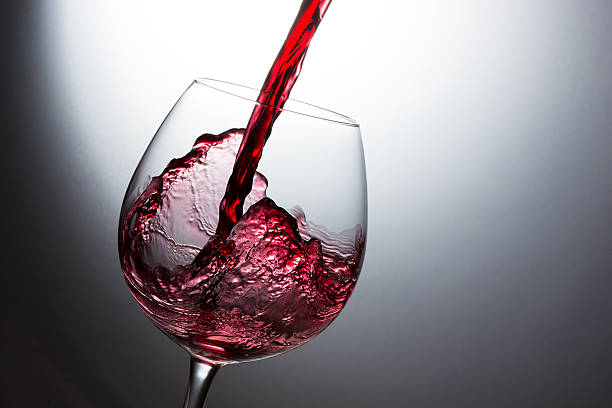 istock Beautiful splash of red wine 621570210