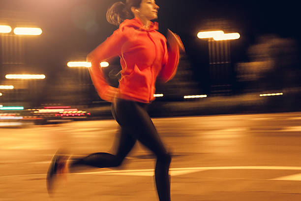 istock Female Athlete Running Through an Urban Enviroment 621571312