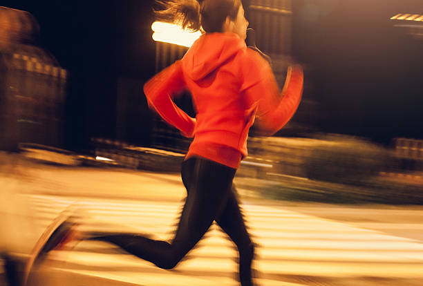 istock Female Athlete Running Through an Urban Enviroment 621571366