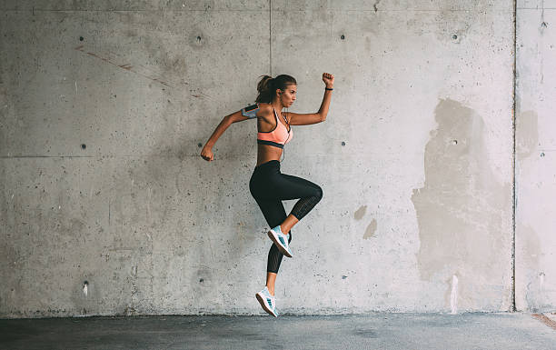 istock Sportswoman jumping 621572060