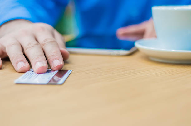 istock Man Hands giving plastic card to waiter to pay order. 621573646