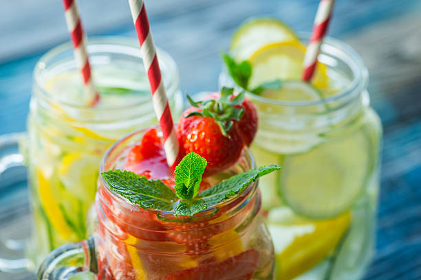 istock Jugs with lemon, lime, strawberry and cucumber infused water 621573954