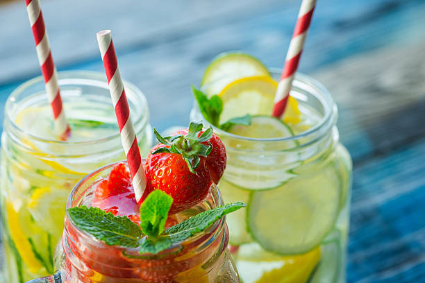 istock Jugs with lemon, lime, strawberry and cucumber infused water 621574090
