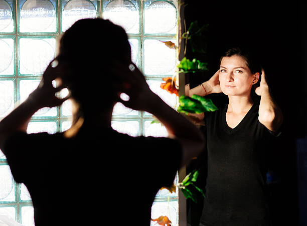 istock Sensual woman arranging herself on the mirror 621574118