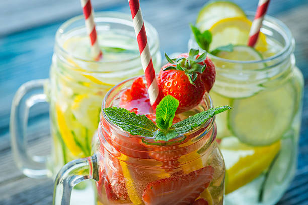 istock Jugs with lemon, lime, strawberry and cucumber infused water 621574218