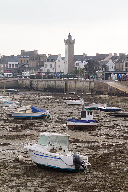 istock boats  at low tide in a harbour 621577360