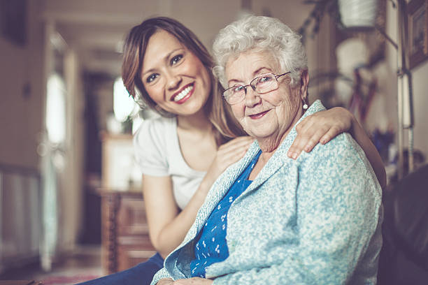 istock Social worker is visiting a senior woman 621577568