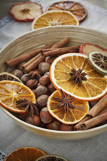 istock Bowl of hazelnut with cinnamon sticks 621578242