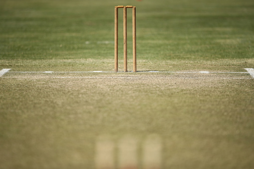 A general view of a cricket pitch and stumps  are seen during a break in play of a cricket match