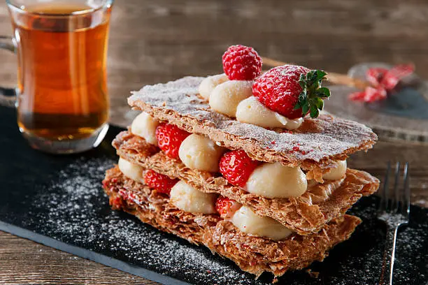 Millefeuille dessert with strawberries dessert sweet on black background cake