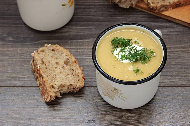 istock Lentil cream soup with cream cheese and dill in mug 621580486