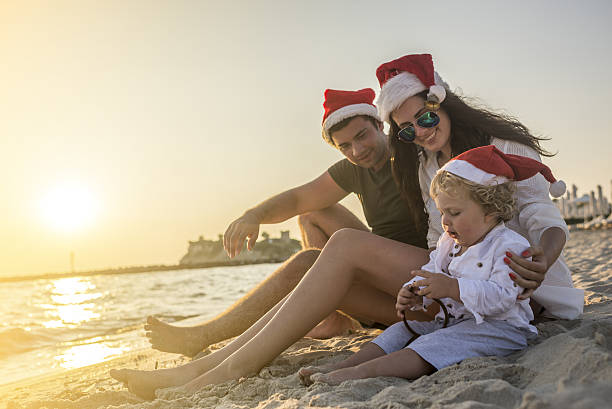 istock Family Christmas time at the beach 621580804