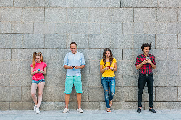 istock Mixed age range of people social networking 621581064