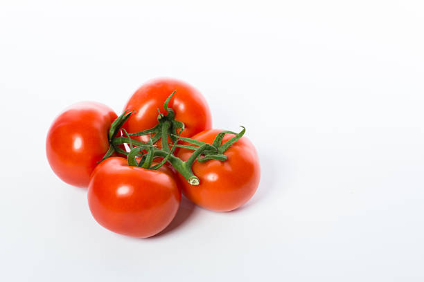 istock Bunch of a fresh and juicy tomatoes isolated 621585152