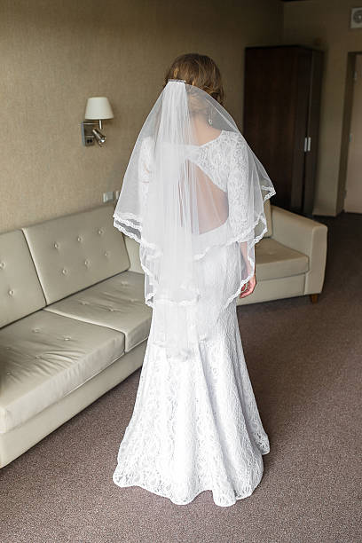 istock Beautiful bride in luxury hotel room. 621585736