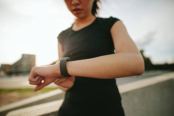 istock Fitness woman checking her performance on smartwatch 621586440