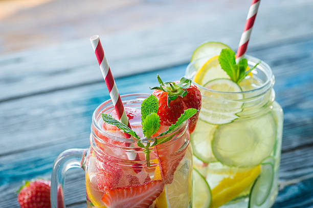 istock Jugs with lemon, lime and strawberry infused water 621587212