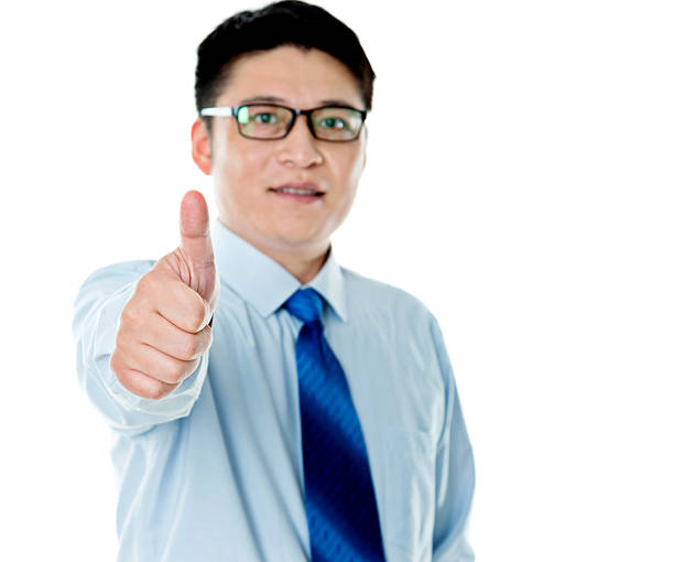 istock Asian businessman with thumbs up 621587428