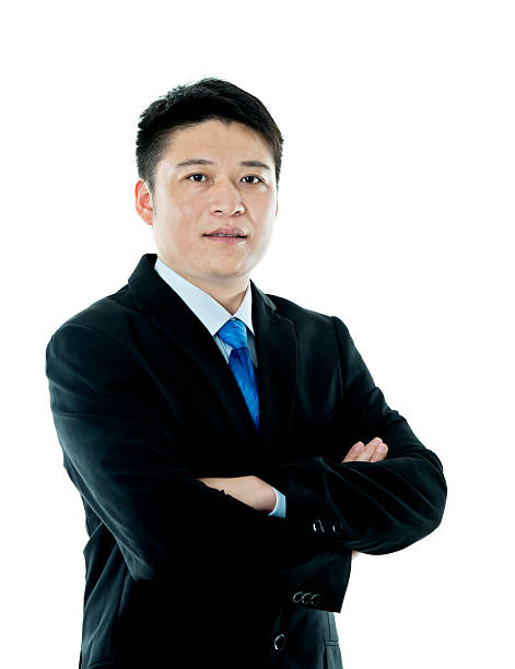 istock Asian businessman standing against white background 621592000