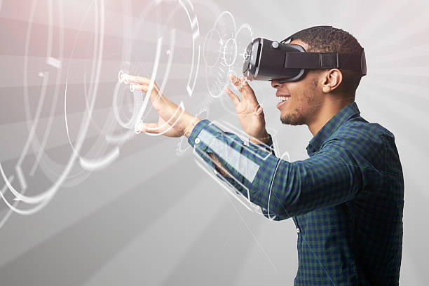 Man Using Virtual Reality Headset Man Using Virtual Reality Headset appearance stock pictures, royalty-free photos & images