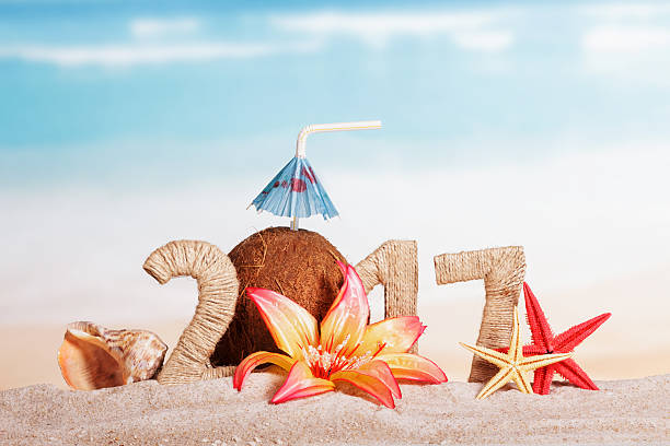 istock Coconut instead number 0 in amount 2017, starfish against sea. 621592346