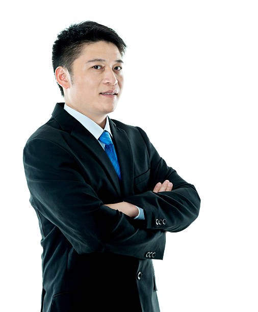 istock Asian businessman standing against white background 621592538