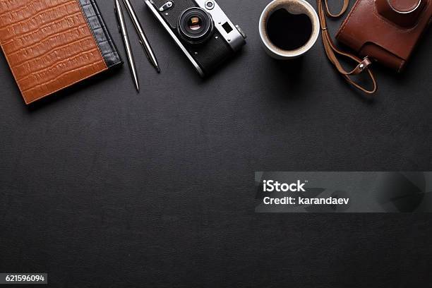 Office Desk With Camera Coffee And Notepad Stock Photo - Download Image Now - Luxury, Desk, Journey