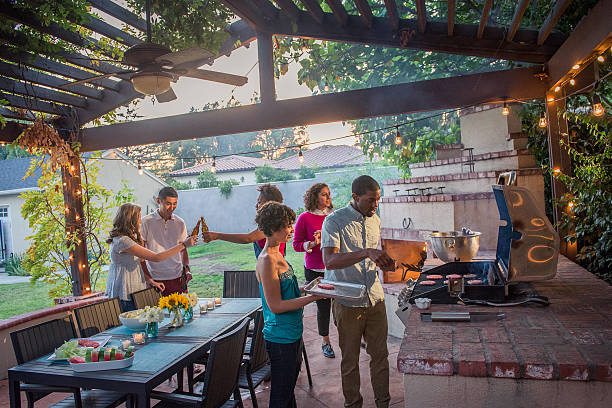 istock Hipsters Grilling at a Summer Backyard BBQ 621596126