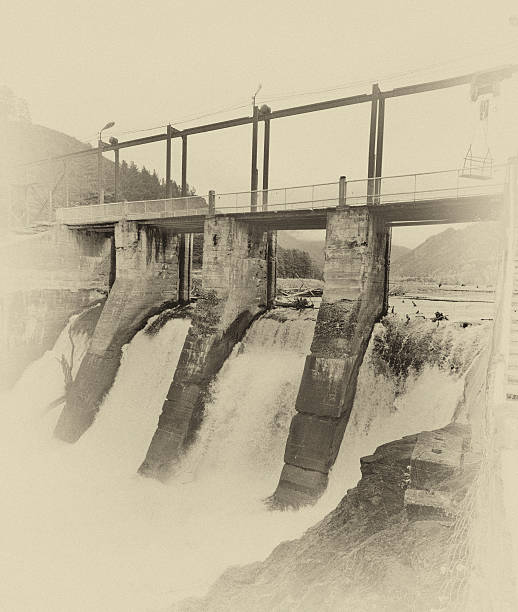 The old hydroelectric power station on the river Chemal after a flood in mountain Altai in Russia. Sepia.
