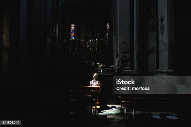 Young Woman In Church Stock Photo - Download Image Now - Church, Dark, Women