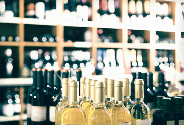 istock View on supermarket shelves with wine bottles 621596318