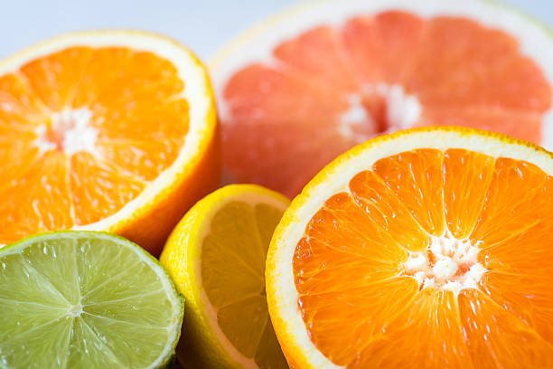 Close shot of various citrus fruits. stock photo