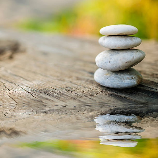 istock Stones on wooden floor reflection 621596508