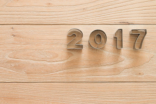 istock New Year 2017 on a wood background 621597738