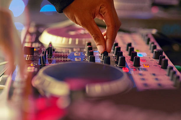 Let's get this party started Closeup shot of a DJ  mixing music on a turntable dance  electronic music photos stock pictures, royalty-free photos & images