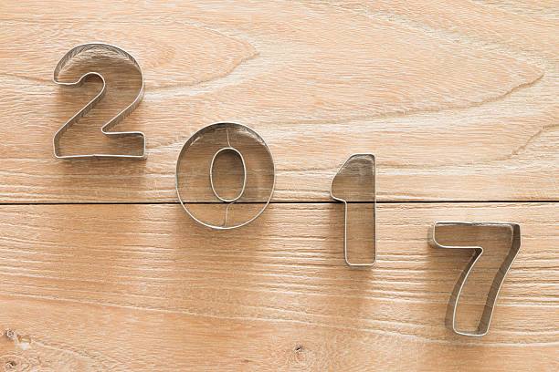 istock New Year 2017 on a wood background 621598648