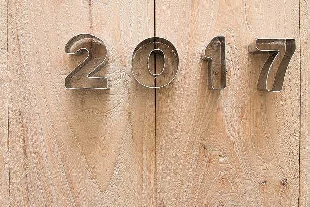 istock New Year 2017 on a wood background 621599424