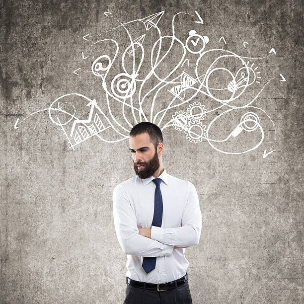 istock Businessman standing in front of wall 621600682