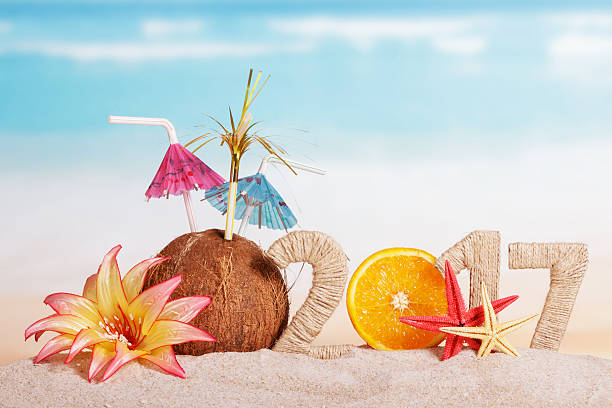 istock Orange instead number 0 in 2017, coconut, starfish against sea. 621603256